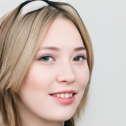 Joyful white young-adult female with long  brown hair and blue eyes