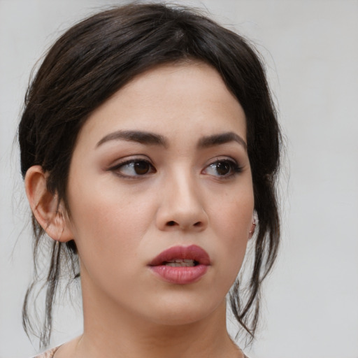 Neutral asian young-adult female with medium  brown hair and brown eyes