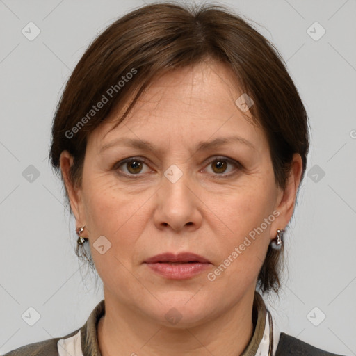 Joyful white adult female with medium  brown hair and grey eyes