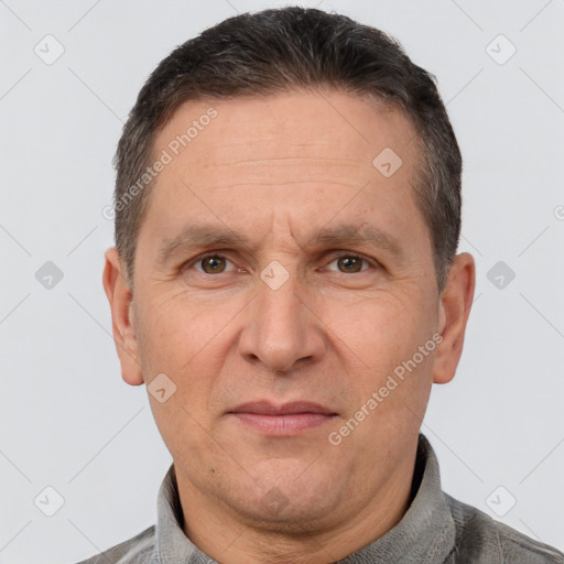 Joyful white adult male with short  brown hair and brown eyes