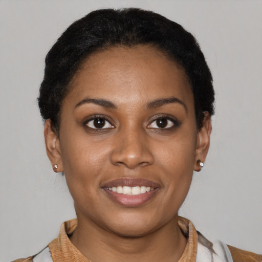 Joyful latino young-adult female with short  brown hair and brown eyes