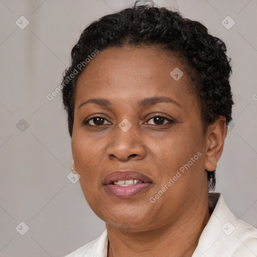 Joyful black adult female with short  brown hair and brown eyes