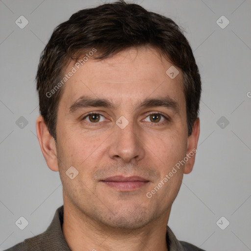 Joyful white adult male with short  brown hair and brown eyes