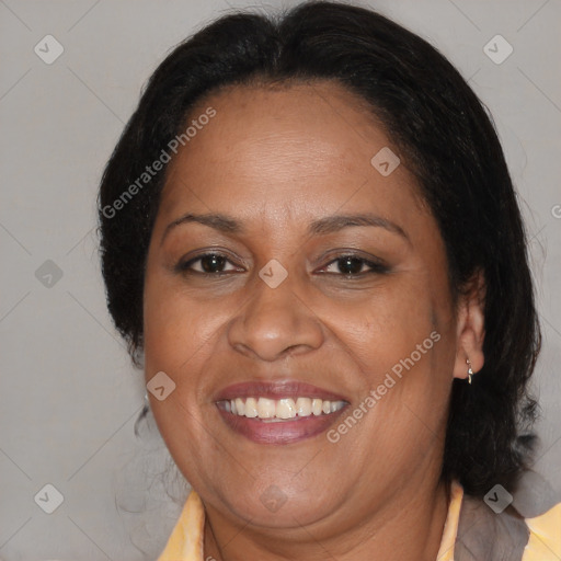 Joyful black adult female with medium  brown hair and brown eyes