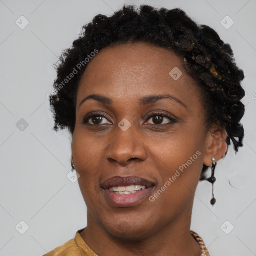 Joyful black adult female with short  brown hair and brown eyes