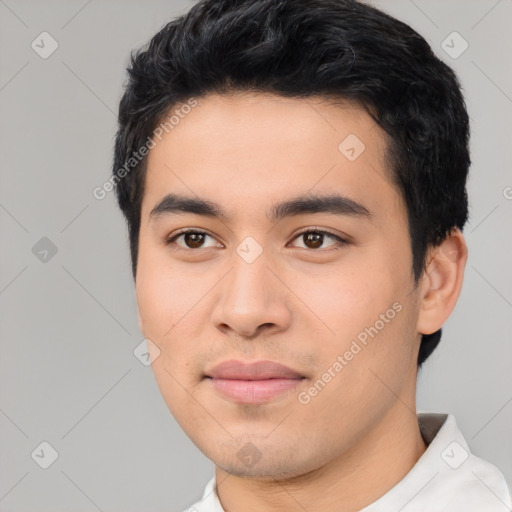 Joyful asian young-adult male with short  black hair and brown eyes