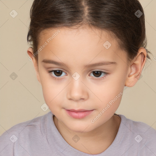 Joyful white child female with short  brown hair and brown eyes