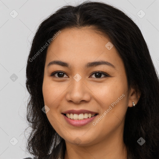 Joyful asian young-adult female with long  brown hair and brown eyes