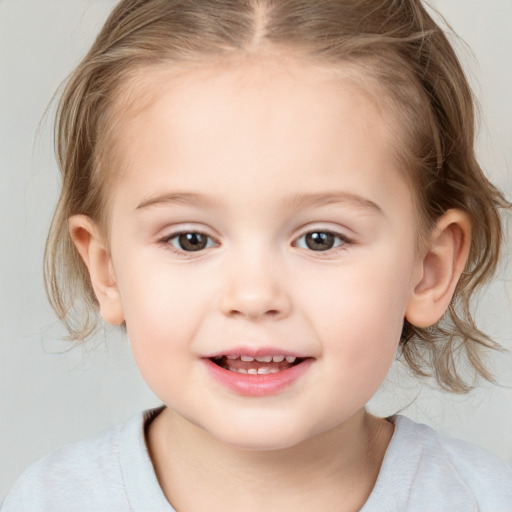 Joyful white child female with medium  brown hair and grey eyes