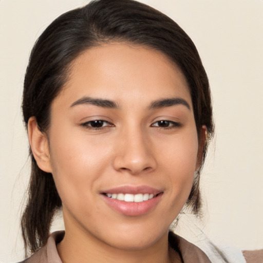 Joyful white young-adult female with medium  brown hair and brown eyes