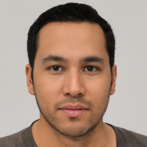 Neutral latino young-adult male with short  black hair and brown eyes