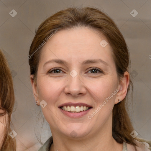 Joyful white adult female with medium  brown hair and grey eyes