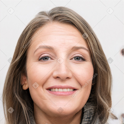 Joyful white adult female with long  brown hair and grey eyes