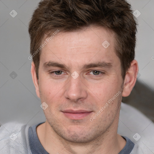 Joyful white adult male with short  brown hair and grey eyes