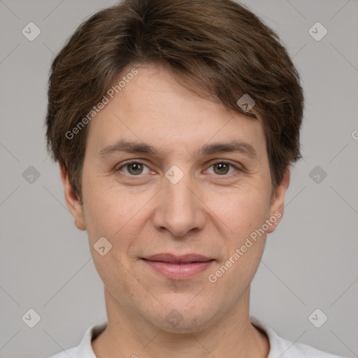 Joyful white adult male with short  brown hair and grey eyes