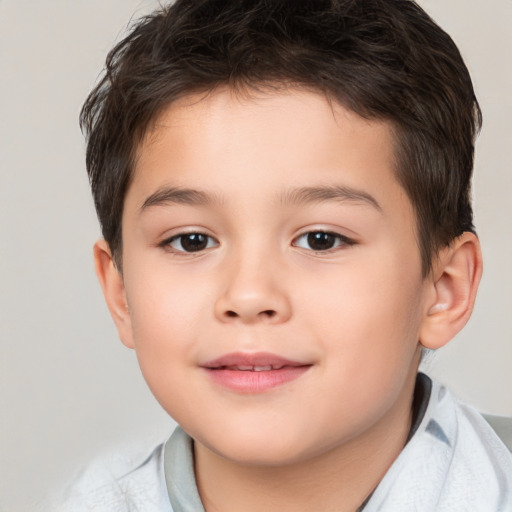 Joyful white child male with short  brown hair and brown eyes