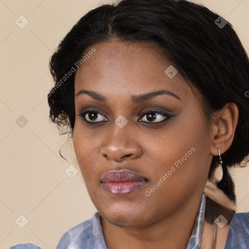 Joyful black young-adult female with medium  black hair and brown eyes