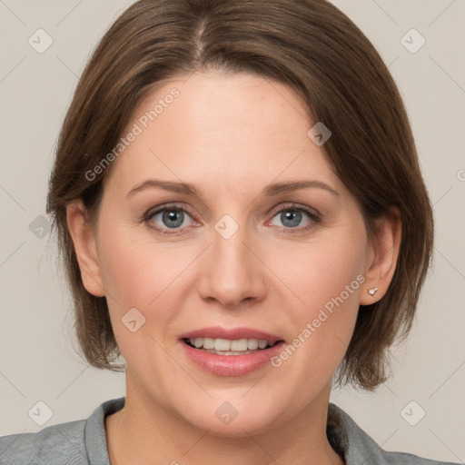 Joyful white adult female with medium  brown hair and grey eyes