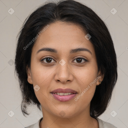 Joyful latino young-adult female with medium  brown hair and brown eyes