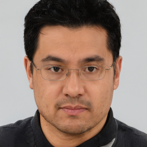 Neutral asian adult male with short  black hair and brown eyes