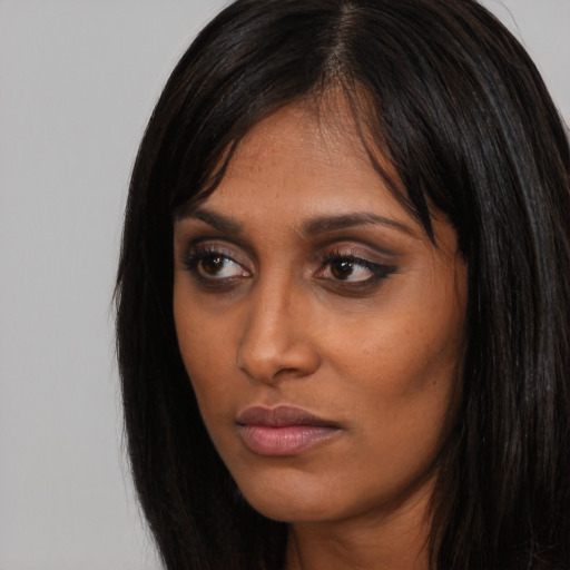 Neutral asian young-adult female with long  brown hair and brown eyes