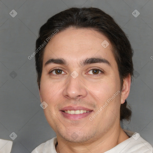 Joyful white adult male with short  brown hair and brown eyes