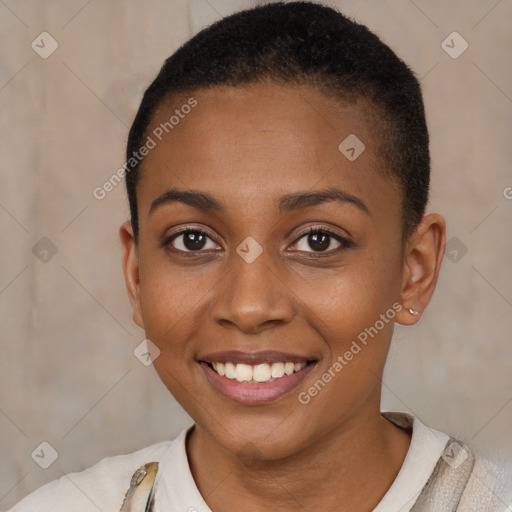 Joyful black young-adult female with short  brown hair and brown eyes