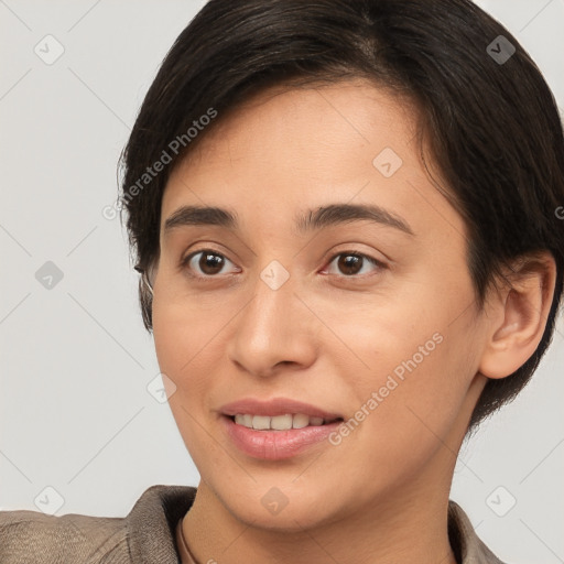 Joyful white young-adult female with short  brown hair and brown eyes