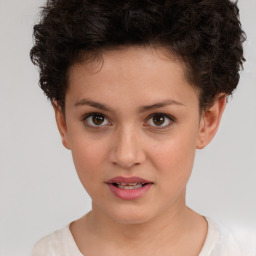 Joyful white child female with short  brown hair and brown eyes