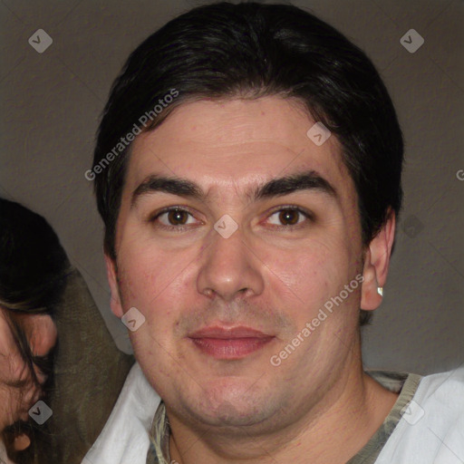 Joyful white adult male with short  black hair and brown eyes