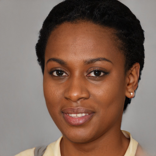 Joyful latino young-adult female with short  black hair and brown eyes