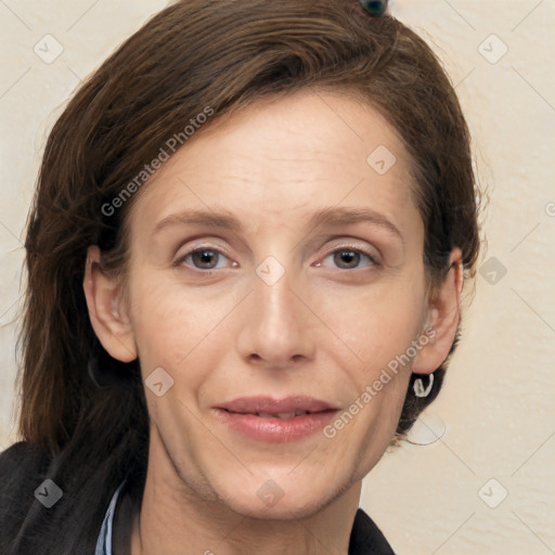 Joyful white adult female with medium  brown hair and grey eyes