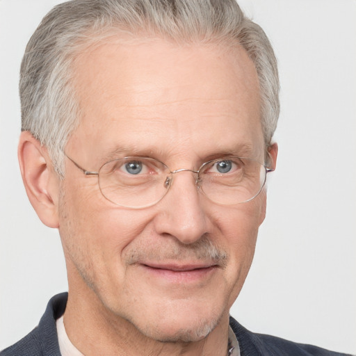 Joyful white middle-aged male with short  gray hair and blue eyes