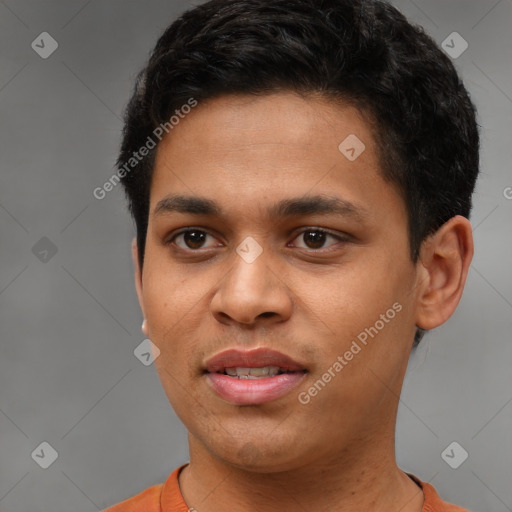 Joyful latino young-adult male with short  black hair and brown eyes