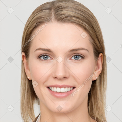 Joyful white young-adult female with long  brown hair and blue eyes