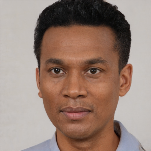 Neutral black young-adult male with short  black hair and brown eyes