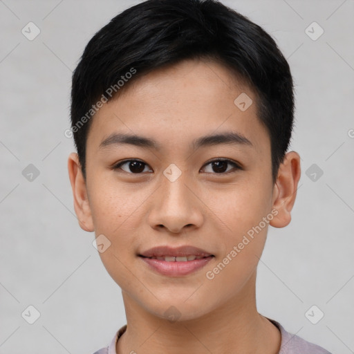 Joyful asian young-adult male with short  brown hair and brown eyes
