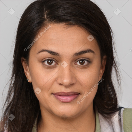 Joyful latino young-adult female with medium  brown hair and brown eyes