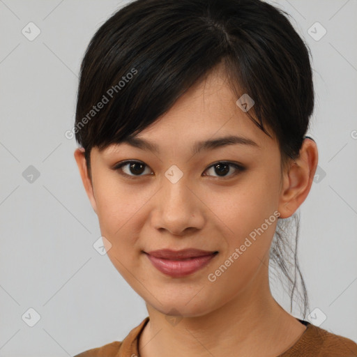 Joyful asian young-adult female with short  brown hair and brown eyes