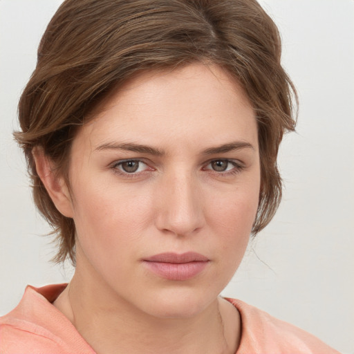 Neutral white young-adult female with medium  brown hair and grey eyes