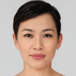 Joyful asian young-adult female with short  black hair and brown eyes