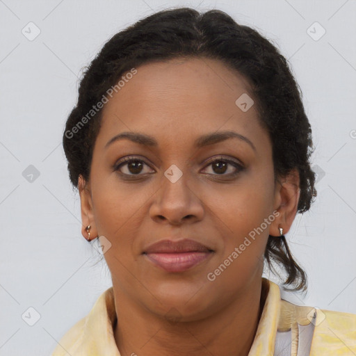 Joyful black adult female with medium  brown hair and brown eyes