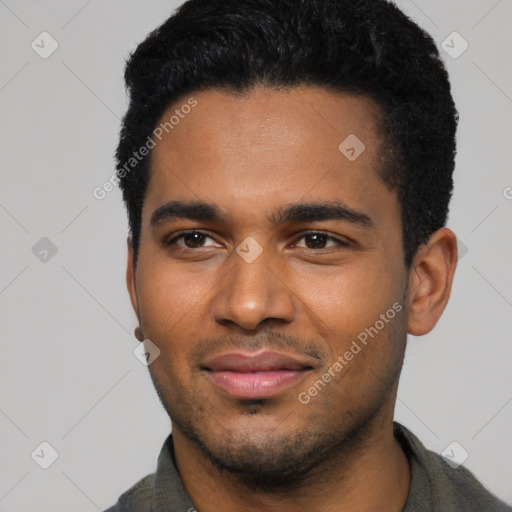 Joyful black young-adult male with short  black hair and brown eyes