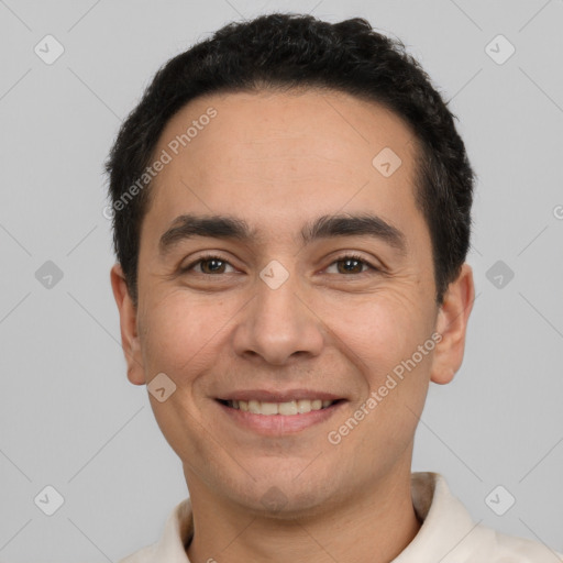 Joyful white young-adult male with short  black hair and brown eyes