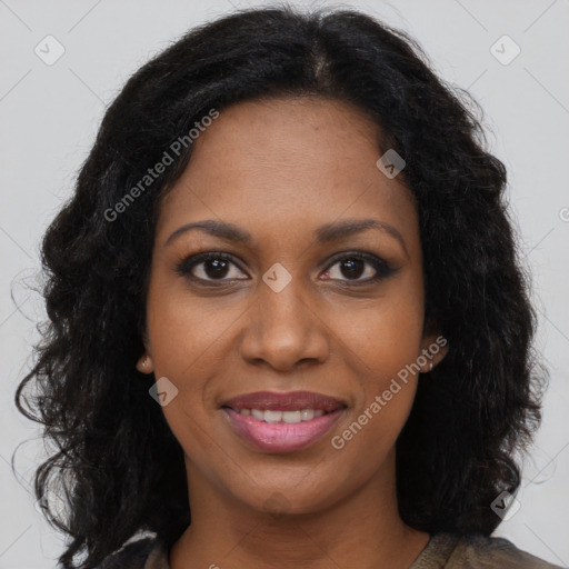 Joyful black young-adult female with long  brown hair and brown eyes