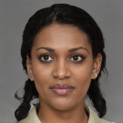 Joyful black young-adult female with medium  black hair and brown eyes
