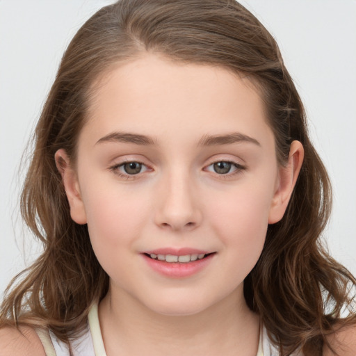 Joyful white child female with medium  brown hair and brown eyes