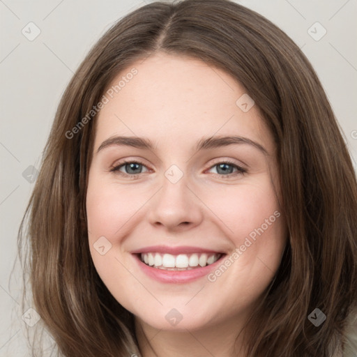 Joyful white young-adult female with long  brown hair and green eyes