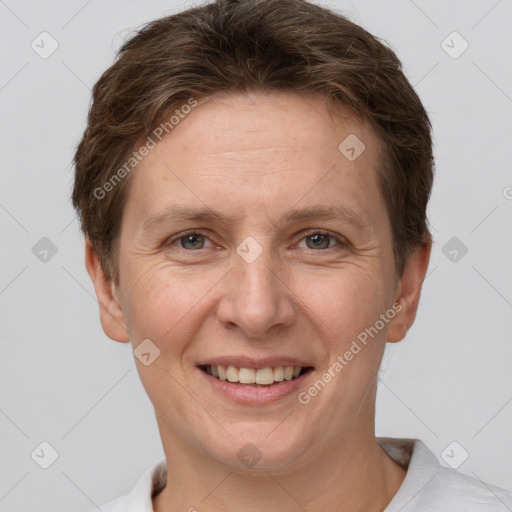 Joyful white adult female with short  brown hair and grey eyes