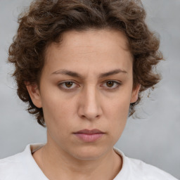 Neutral white young-adult female with short  brown hair and brown eyes